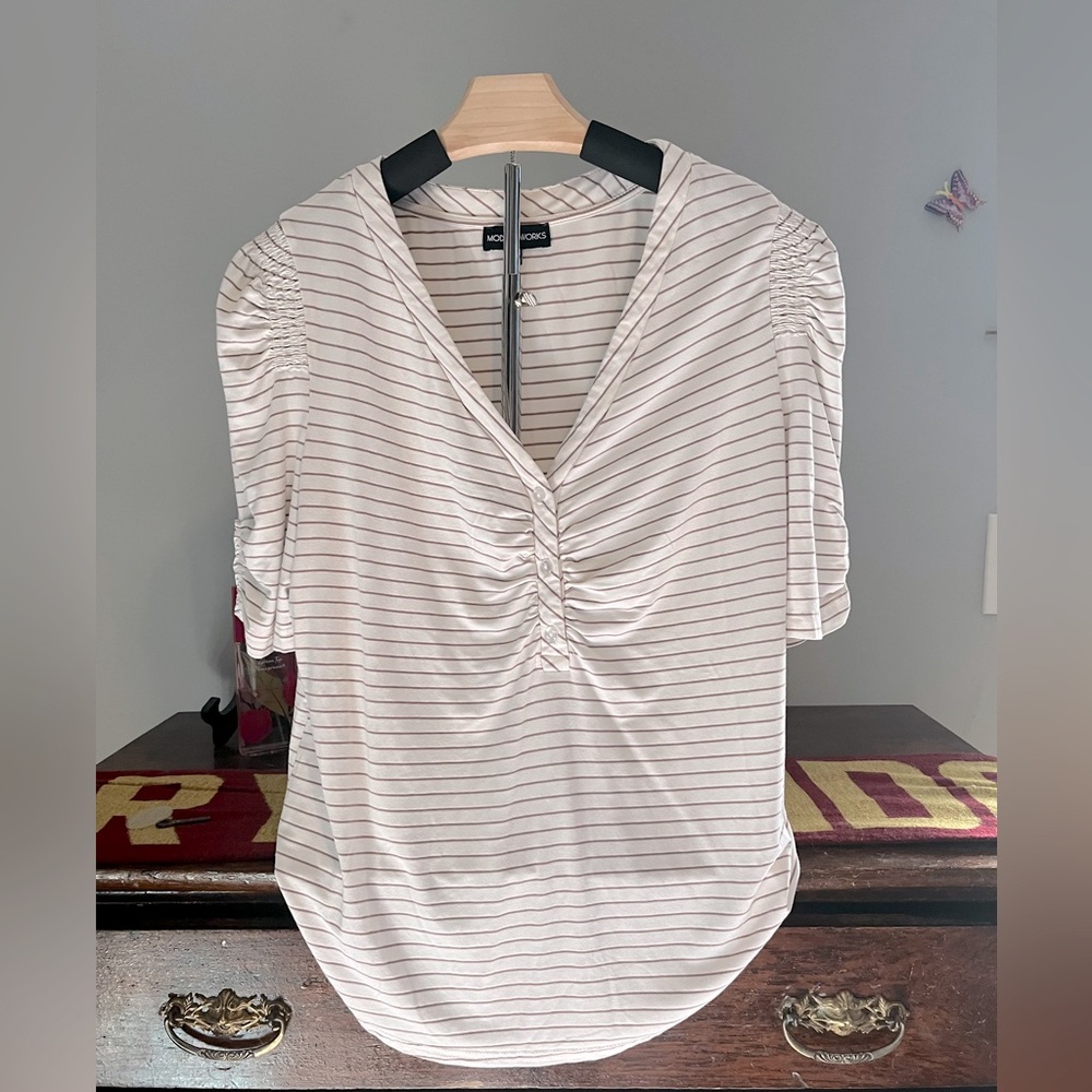 Women's shirt by modern Works. Three-quarter sleeve and never worn.